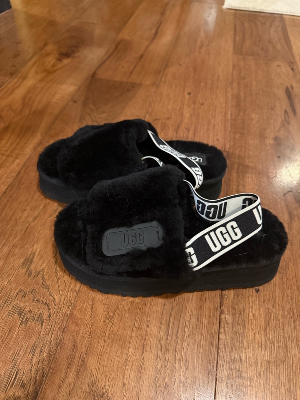 UGG women’s  Black Plush Slide with Branded Strap size 7